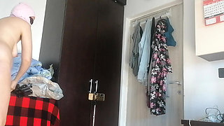 Amateur woman has fun trying on clothes and cutting them. Amateur woman vacuums naked in the house.