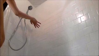 Girl toys herself in the shower, totally unaware of spy cam