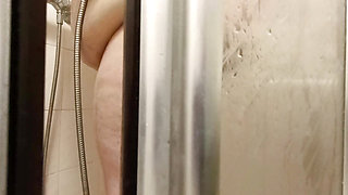 Forbidden look through the crack in the door, I see her showering naked