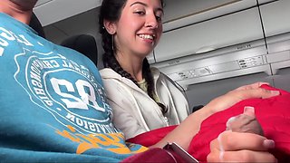 Perverted guy shows his cock midflight, she jerks him off