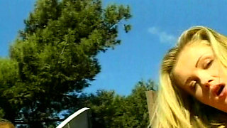 Petite blonde lesbians having fun by the pool