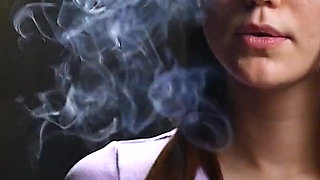 18 Aged Girl Is Smoking Two Strong Cork Cigarettes