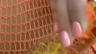 Glass Dildo Solo in an Orange Fishnet Bodysuit - Busty Brunette Plays on the Couch