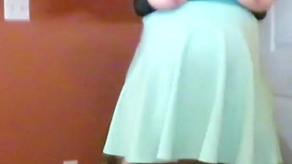 Nurse Vicki plays with a rubber ball in a mini skirt, sexy stockings and high heel mini boots