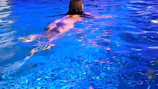 Monika Fox In Purple Bikini Swims In Pool & Poses By Window