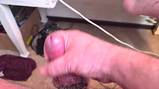 Grandpa Sits in Armchair and Plays with His Little Cock