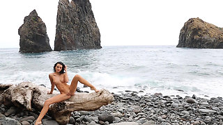 Young Sapphira shows off her body on the beach