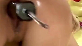 Sexy blonde lubricates her ass before getting a strap-on inserted