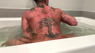 Muscle Goddess Fucks Her Big Clit with the Shower Nozzle