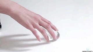 Slim Russian beauty explores sensual solo pleasure with glass toy