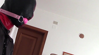 Laura hooded in a very close view of a great blowjob action with ring gag and huge cum swallow