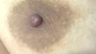 Mom plays with her big and delicious nipples