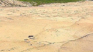 Teasing in Red Bikini on the Beach