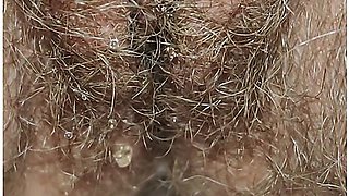 Best close-up of peeing on a thick, hairy pussy