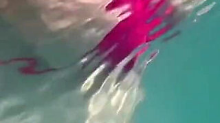 Artemisia Love Sexy and Horny Underwater Showing Her Big Tits in a Super Micro Bikini and You Can See Her Aureolas…