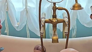 Two Busty MILFs Play with Each Other and Pour Milk Over Each Other's Bodies in the Bathtub.