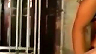 Brunette Dominatrix Teases Her Masked Caged Slave
