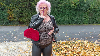 Naughty Granny Tongue Out Flashing Big Tits in Public