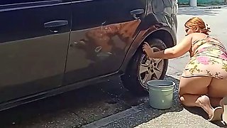 HOT GIRL WASHES HER CAR SHOWING OFF ON THE STREET