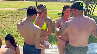 Hot Wives Slip and Slide Into Wild Outdoor Orgy