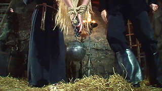 Witch Hangs Upside Down and Gets Drizzled with Black Wax