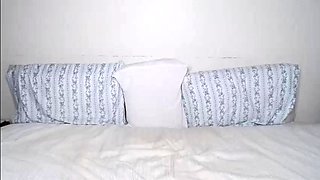 Small titted brunette Sharron with glasses masturbates