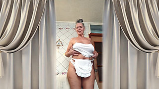 Hot Housewife Lukeria Flirts in the Kitchen in a White Thong and a Small Apron