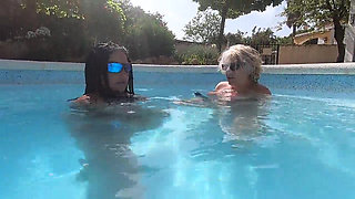 Camilla and Cheyenne Play with a double ended dildo in the pool
