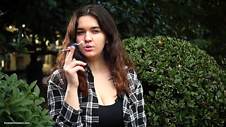 Sweet and Busty Russian Babe Smoking Cigarette in Nature