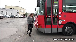 Crazy solo pissing on the pave with a hot short-haired girlfriend Suzie