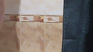 A Neighbor with Big Tits and a Big Ass Takes a Bath and Shaves Her Pussy