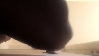 High-Heeled Milf Sucks and Fucks in a Catsuit at a Gloryhole
