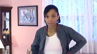 Cute little black chick shows off her skinny beautiful bod on a couch