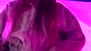 Smoking a Cigarette Outdoor While Wearing Only a Bikini and a Jacket