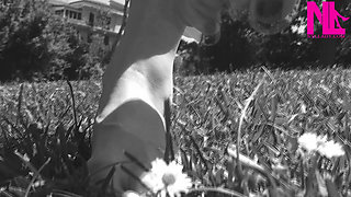 Nyllady Walking Barefoot on Th Grass in a Park