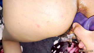 Dulce loves double penetration &mdash; dildo in her pussy and deep cock in the ass on the bed while screaming