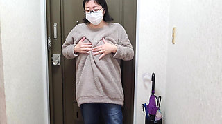 A Married Woman Masturbating Passionately in Front of the Entrance