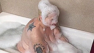 Naughty Bubbler Getting Soapy Masterbating in the Tub Her Pussy She Rubs