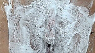 Close-up of Shaving the Vagina with a Trimmer and a Razor