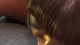 Ebony milf gives sloppy head in car