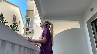 Blonde beauty naked on the balcony