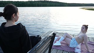 Slim teens were laying naked by the lake and lucky guy ended up in threesome