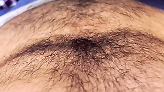 A girl with a tattoo on her arm licks her boyfriend's dick at home