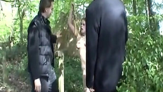 A Stunning Looking German Brunette Gets Punished in the Woods