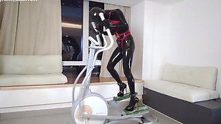 Mz27 - a Girl Bound in Latex Walks on a Treadmill