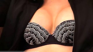 Redhead ladyboy in black fishnet stockings jerks off her