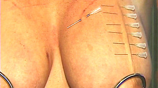 Redhead MILF Submits to Weighted Nipple Clamps